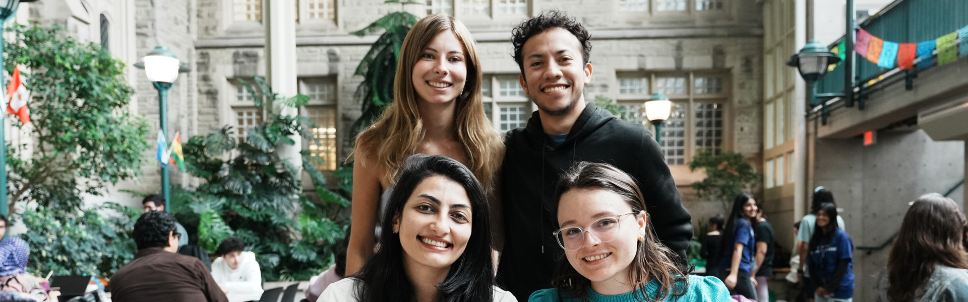 students smiling the International and Graduate affairs building