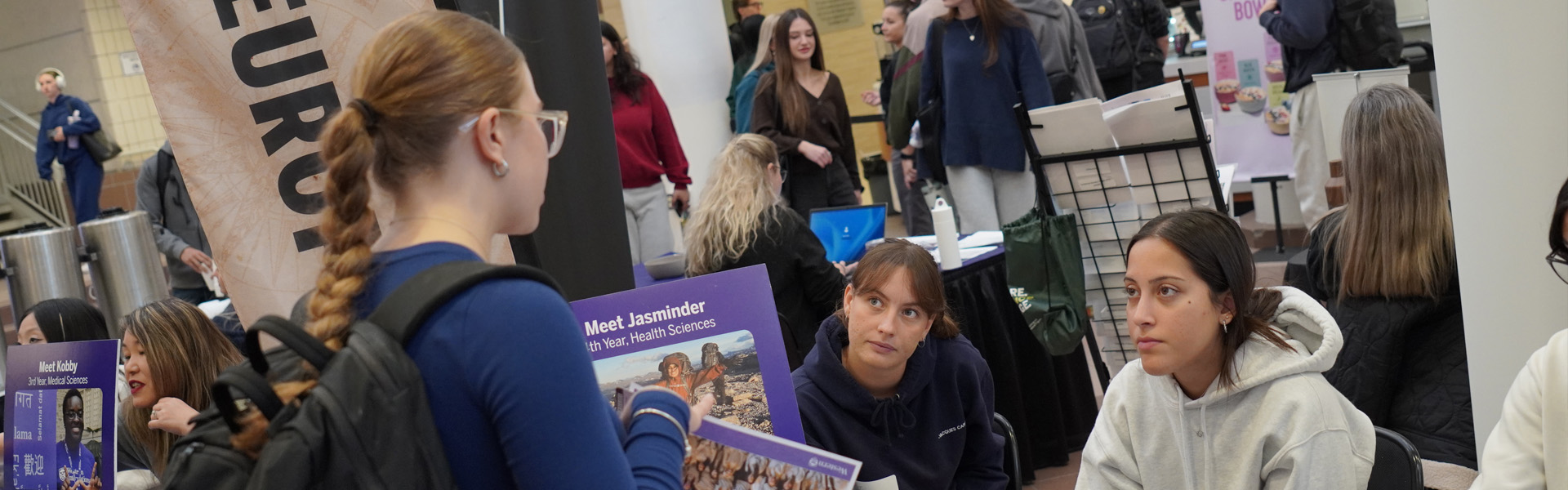A student discusses options to learn abroad with previous learning abroad participants