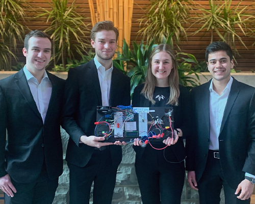 Bailey Thompson, BESc’22, Bruce Gillespie, BESc’22, Adam Kidd, BESc’22 and Parth Vachharajani, BESc’22 holding prototype of hyperloop charger