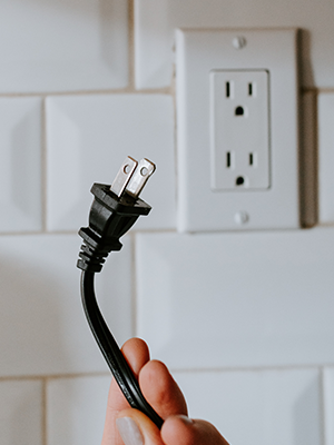 plug with type A pins and wall outlet with type B holes.
